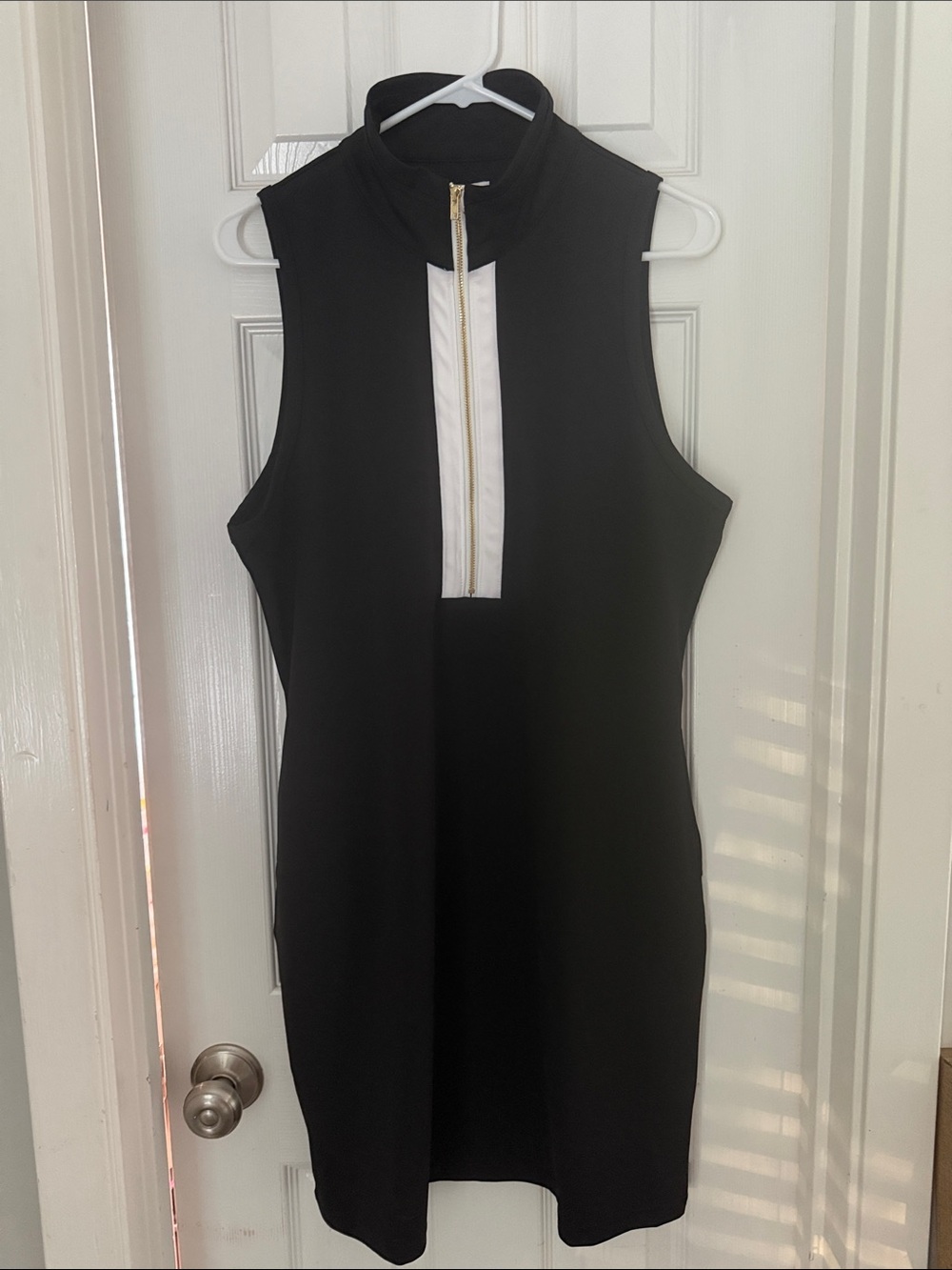 Sleeveless Black Midi Dress with White Zip Detail